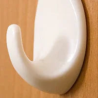 Adhesive hooks in packaging