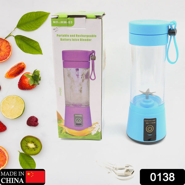 Portable juice blender with blue lid and purple base on a white background with fruits and packaging.