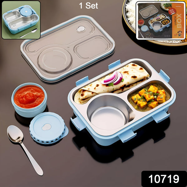 Blue and gray lunch box with compartments containing food on a dark surface.